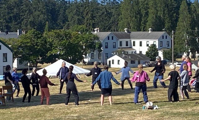 Qigong in outdoor setting with Rose Allen